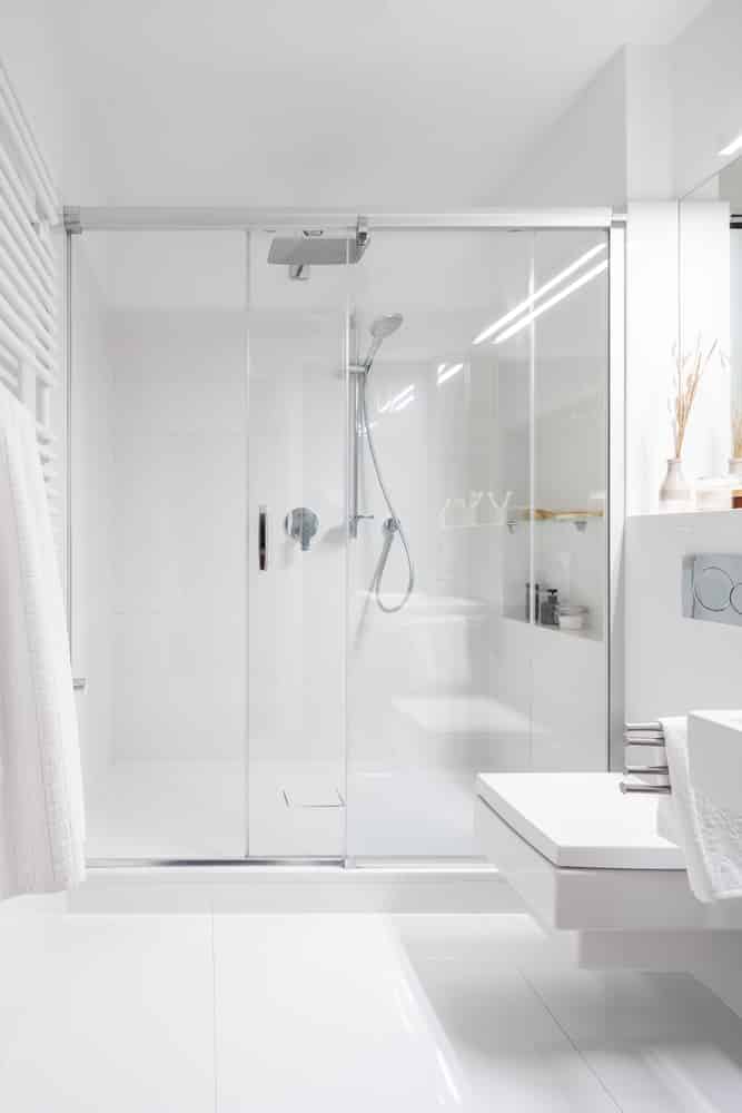 Bathroom with spacious shower sliding glass shower door